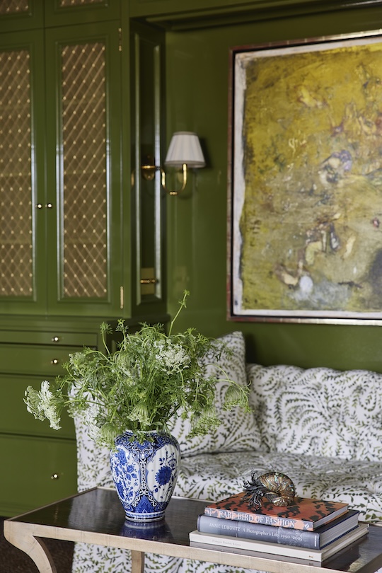 A Chinese blue & white porcelain vase on a coffee table in a room designed by Suzan Hadaway 